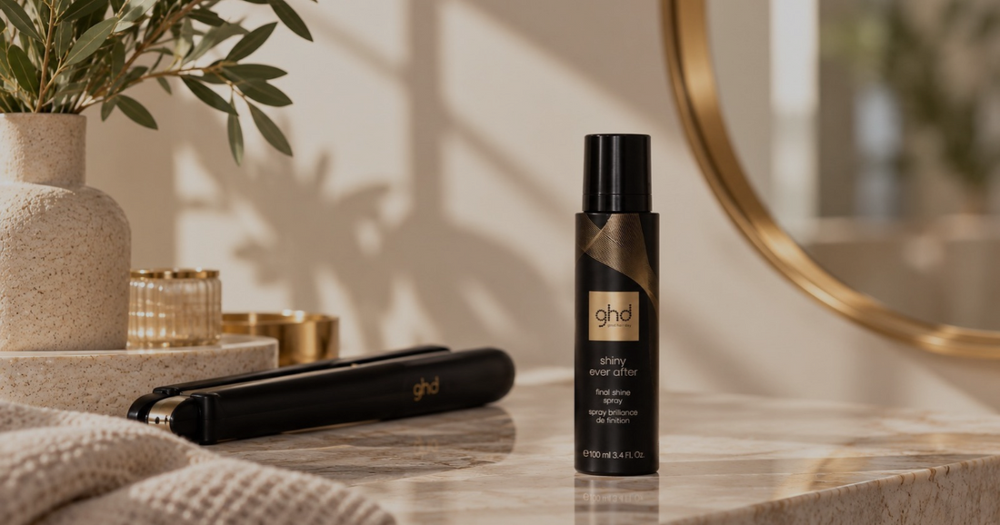 ghd Shiny Ever After shine spray and ghd hair straightener on a salon-style vanity.